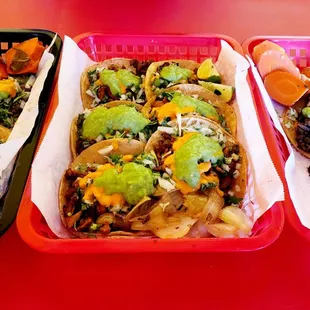 three trays of tacoss