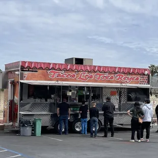 people ordering food from a food truck