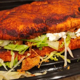 a chicken sandwich with lettuce