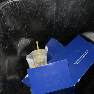 a blue box with a drink in it