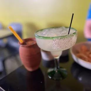 a margarita with a straw in a glass