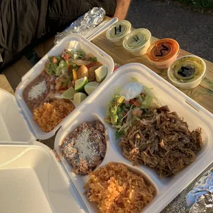 a variety of food in a styrofoam container