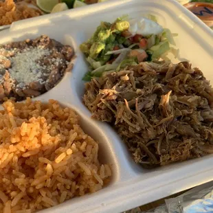 a variety of foods in a styrofoam container