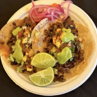 Two carne asada tacos (those pickled onions are hot as shit!!!)