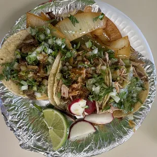 Two carnitas and one asada taco.
