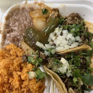 Taco plate with rice, beans, and grilled onion/jalapeños