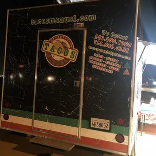 a taco truck parked on the side of the road