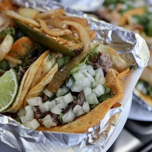Cabeza tacos for the win! Don&apos;t forget to ask for the grilled onions and jalapeños on the side!