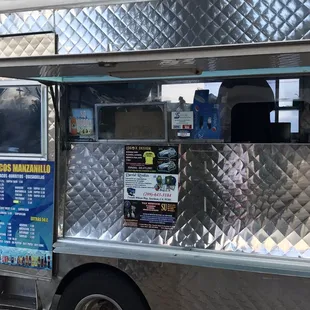 a taco truck parked on the side of the road