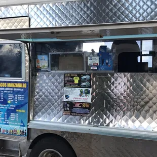 a taco truck parked on the side of the road