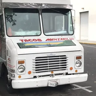 a taco truck parked on the side of the road