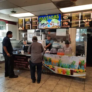 Order at the counter then wait outside. The food will be passed through the window on the right to the outside tables.