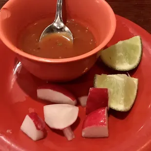 a bowl of tacos with a spoon