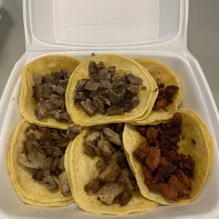 Carnitas, cabeza, and chorizo tacos.