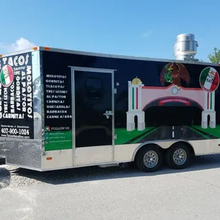 a taco truck parked in a parking lot