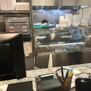 Ladies cooking the food and making hand made tortillas.