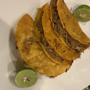 a plate of tacos on a table