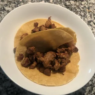 a close up of a taco on a plate