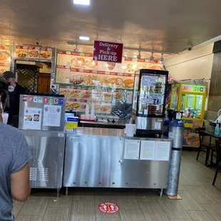 a woman standing in front of a counter