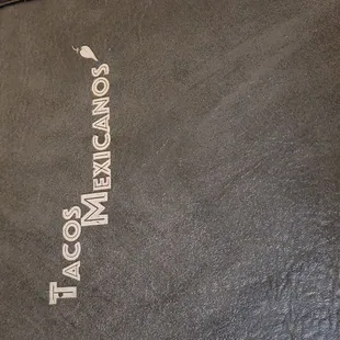 a menu book on a table