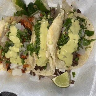 two tacos in a styrofoam container