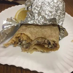 Carne Asada burrito with sour cream and cheese added.