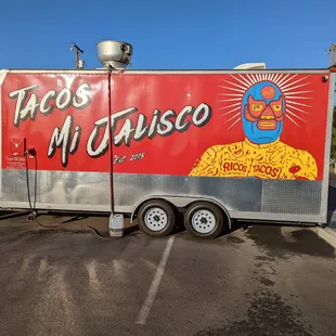 a taco truck in a parking lot