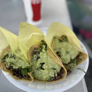 two tacos with guacamole
