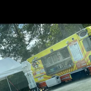 Truck with outdoor tent area with tables