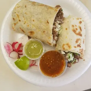 a plate of food with a burrito