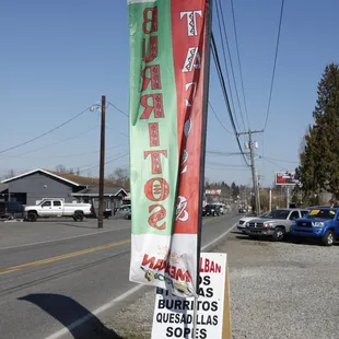 a sign on the side of the road