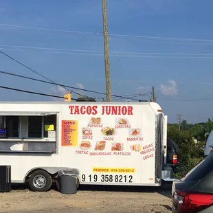 a taco truck parked in a parking lot