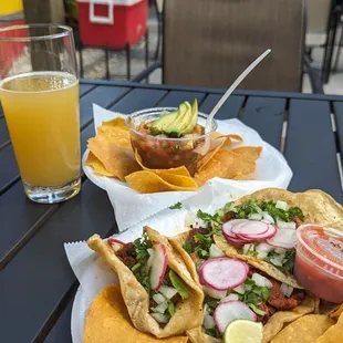 Foreground: Pastor tacos.  Middle: ceviche. Background: Session IPA.  The ceviche has a kick, but is phenomenal.  The tacos are succulent