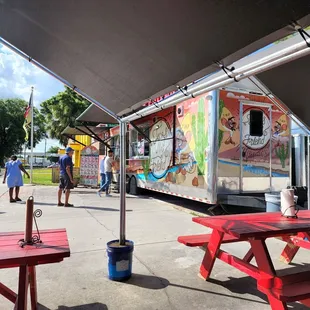 a taco truck parked in a parking lot