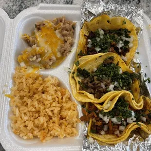Taco combo- chorizo, asada, al pastor with rice and beans.