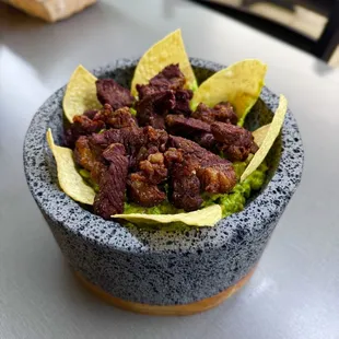 a bowl of beef and tortilla