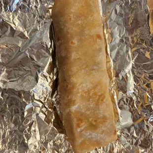 a piece of food wrapped in foil