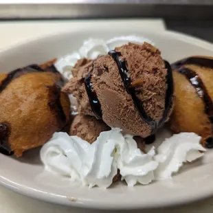ows three desserts on a plate