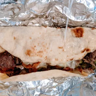 a burrito wrapped in foil