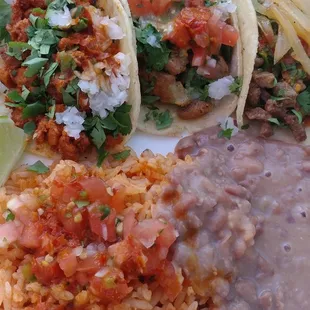 Three Different Tacos with Rice and Beans