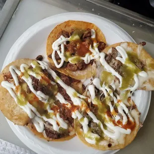 a plate of tacos on a tray