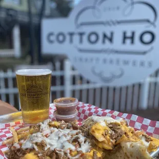 a plate of food and a glass of beer