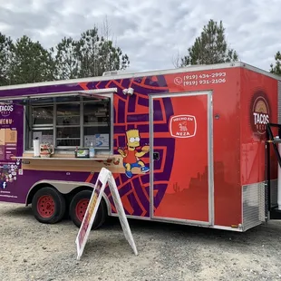 a food truck parked in a parking lot