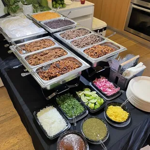 Catering from Tacos Neza, Asada, Al Pastor, Chicken Mole, Black beans, Rice, toppings, salsa