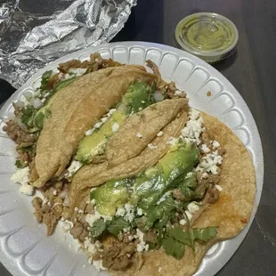 Order of 3 regular corn al pastor tacos w/ everything and avocado salsa.
