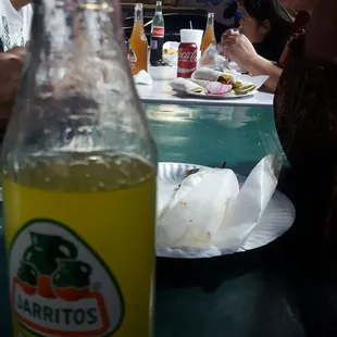 a bottle of tacos on a table