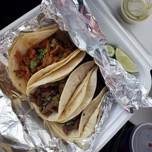 Pastor taco (left), steak tacos (right). The green salsa is very good. Has a good kick to it.