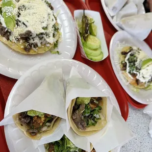 a variety of tacoss on trays