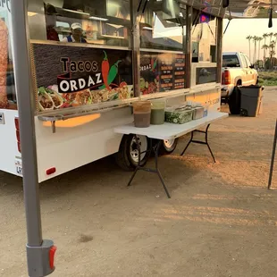 a taco truck parked in a parking lot