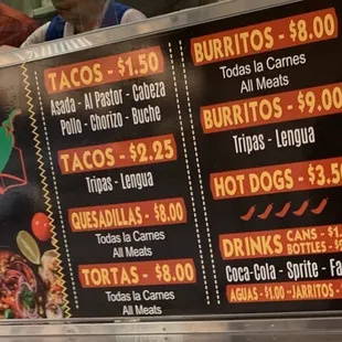 a menu for tacoss and burritos
